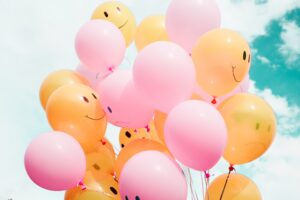 Happy and sad balloons, highlighting how caregivers can improve their mood